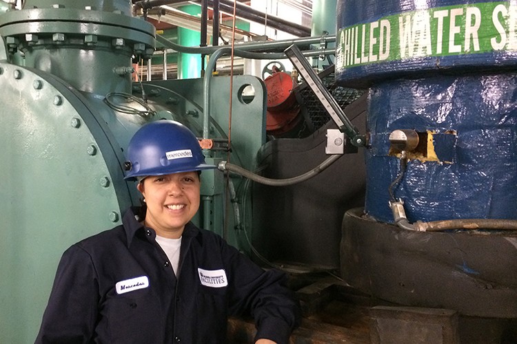 Mercedes Santana, mechanic trainee, at the chiller plant on Columbia’s Morningside campus.
