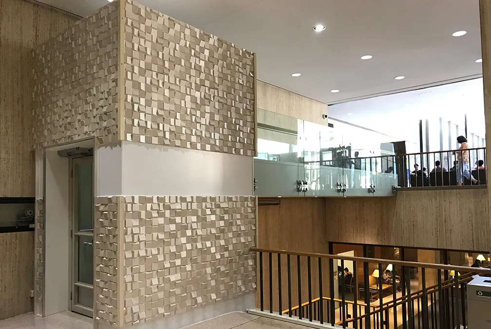 A wheelchair lift was constructed in the International Affairs Building to connect the lower and upper levels of the fourth floor.
